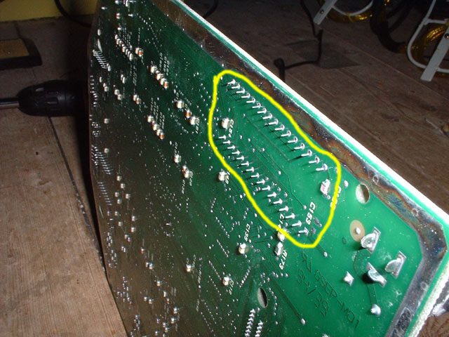 The ROM pins on the solder side of the board